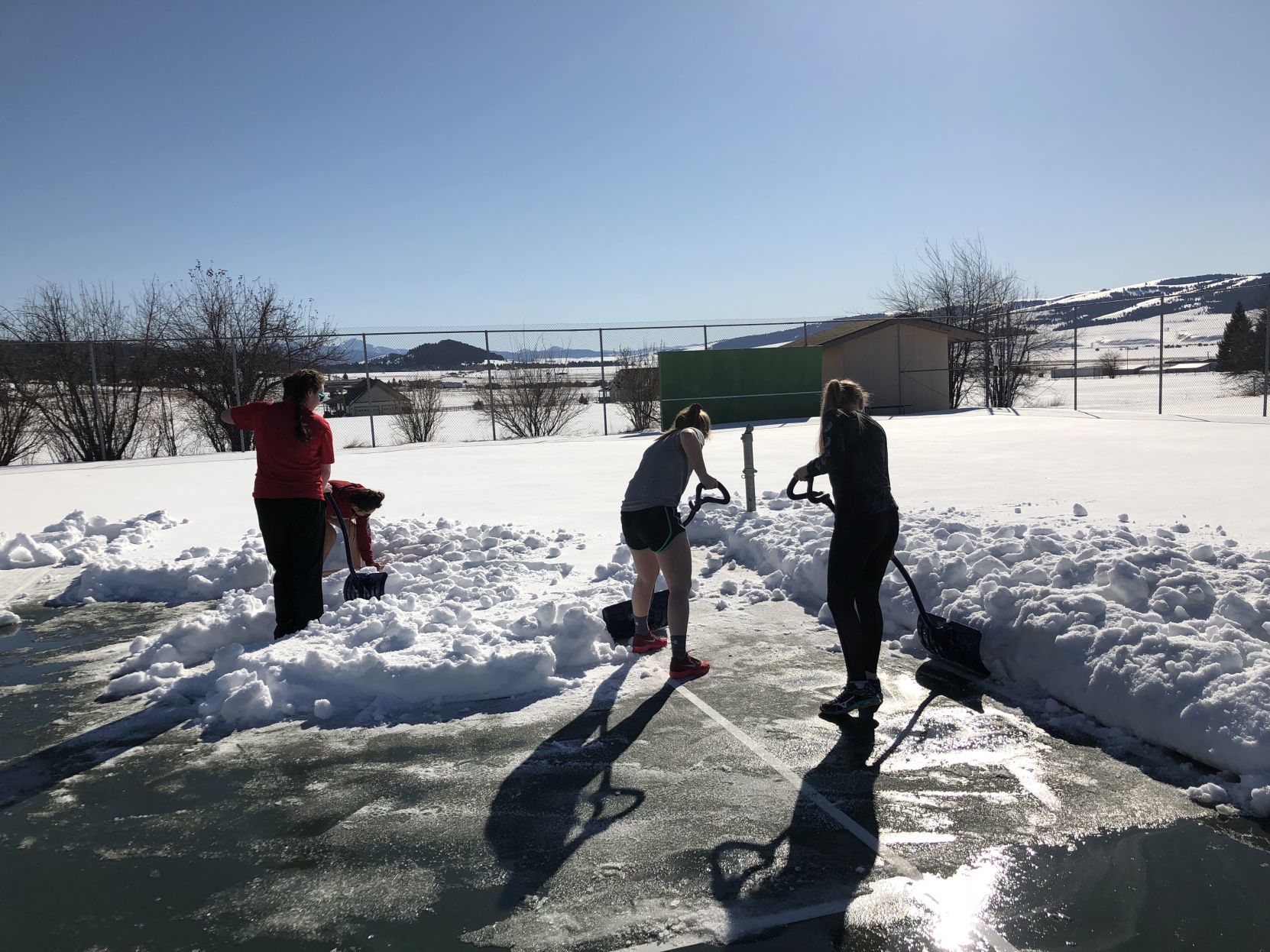 Philipsburg shoveling out their tennis courts